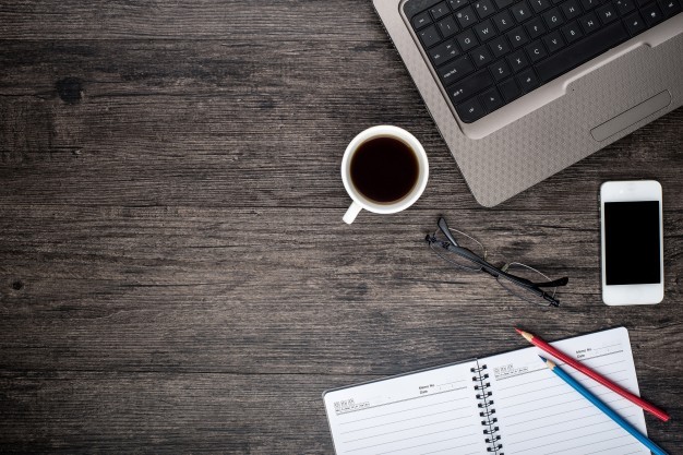 desk-with-laptop-cup-coffee-calendar